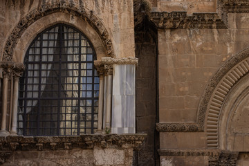 Jerusalem holy land ancient city christian church religion architecture building background of stone wall and arch window