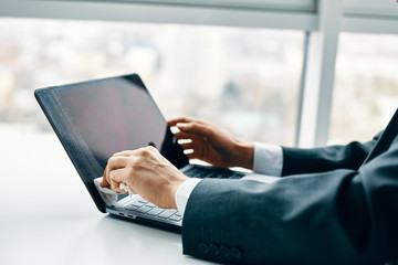 woman working on laptop in cafe