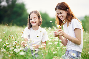 Obraz premium mother and daughter in field