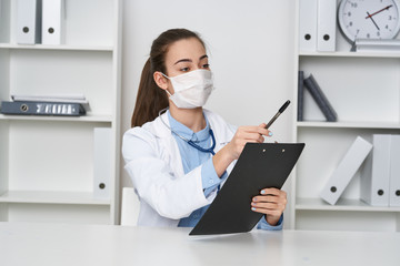 Fototapeta na wymiar female doctor working on laptop in office