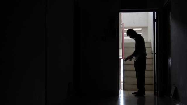 Silhouette of male contract killer shooting victim with gun, committing crime, threatening with weapon, revenge