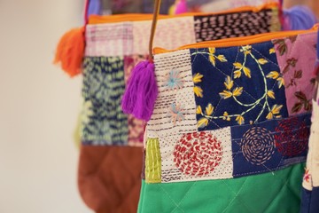 Close up of Handicrafts embroidered bag with traditional pattern texture background