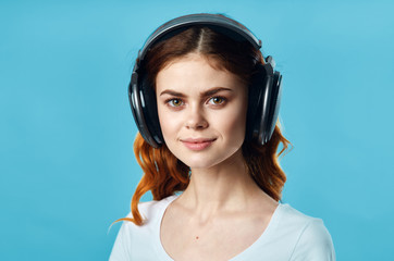 young woman listening to music with headphones