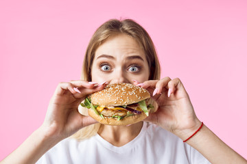 woman with hamburger and french fries