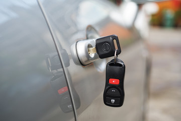 Fototapeta premium Business women Forget bunch of Car keys and remote left in a car door.