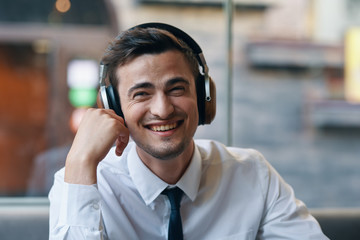 young man listening to music with headphones