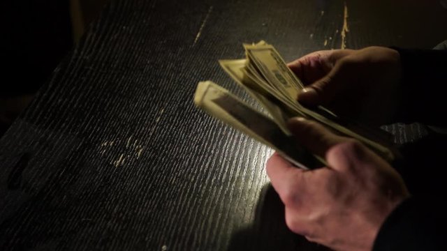 
Counting money in a dark room 