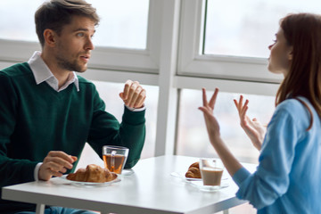 couple having breakfast in cafe