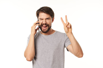 Fototapeta premium young man talking on the phone isolated on white