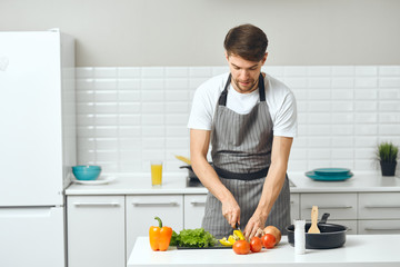 man preparing food in the kitchen