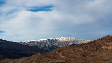 Fototapeta na wymiar Mountain tops covered with snow landscape