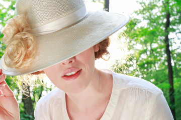Young woman in victorian hat.