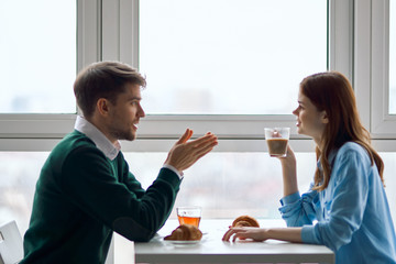 couple having breakfast in office