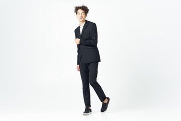 full length portrait of a businessman standing with arms crossed