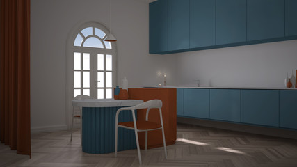 Colorful elegant kitchen in classic room with stucco molded walls, parquet. Arched panoramic window, island with chairs, vase, candles and decors. Blue and orange interior design