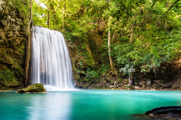 Waterfall and blue emerald water color in Erawan national park. Erawan Waterfall Step 3rd Wang Na Pha , Beautiful nature rock waterfall steps in tropical rainforest at Kanchanaburi province, Thailand