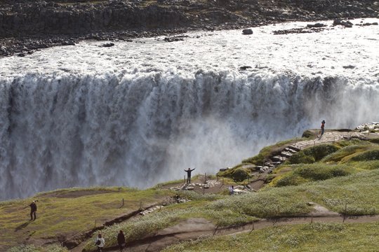 Aerial view of Dettifoss waterfall with tourists on the border, Iceland 