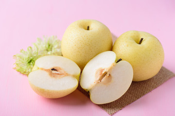 Fresh Asian pear fruit on pink background	