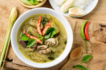 Thai green curry chicken in bowl on wooden background, Thai food	