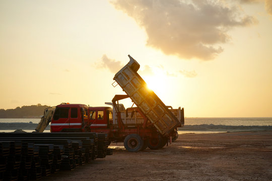 Heavy construction equipment take a rest after work at sunset moment