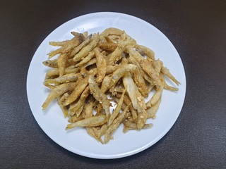 Top view of fried fish in white plate on wooden table as a background, Ready to eat, This food is most popular