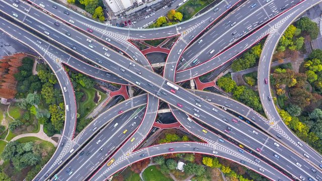 Aerial view Shanghai spectacular elevated highway and convergence of roads, bridges, junction and interchange overpass, viaducts in Shanghai, transportation and infrastructure in urban China, 4K