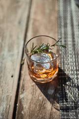 A close up shot of a glass with fine luxury whisky..