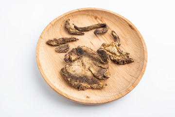 Fototapeta na wymiar A plate of Chinese medicinal herbs alone on a white background