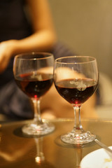Woman drinking wine with lovers on a romantic date