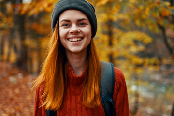 portrait of young woman in autumn park