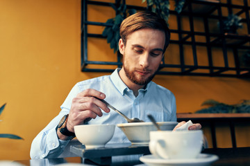 Fototapeta na wymiar young man in cafe
