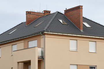 residential house with black tile roof