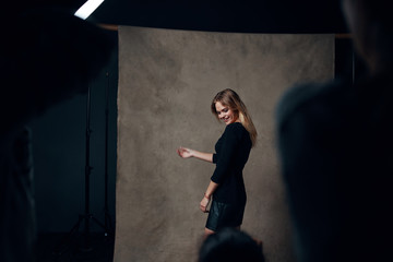 woman in front of brick wall