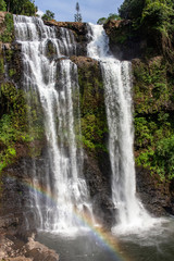 Tad Yuang Waterfall with rainbow in Lao