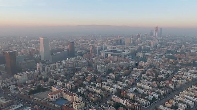 View of the Madrid city from a helicopter, there is a lot of pollution