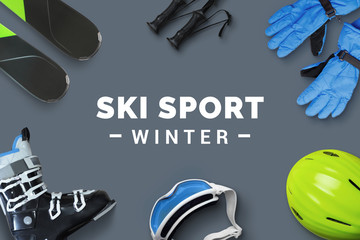 Ski sport winter text surrounded by ski accessories on table. Winter ski sport promotion concept....