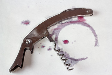 corkscrew with red wine stain
