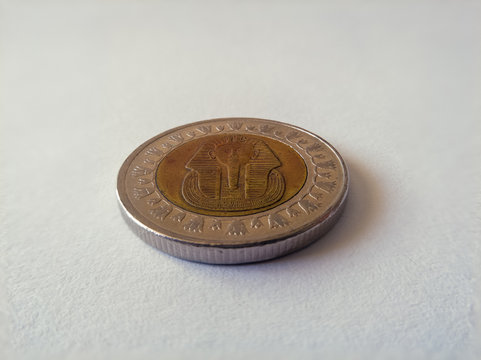 The Egyptian pound is the currency of Egypt. It is divided into 100 piastres, or ersh or 1,000 milliemes. Coin on white background. - Imge