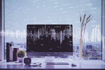 Stock market graph on background with desk and personal computer. Multi exposure. Concept of...