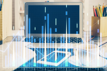 Forex market graph hologram and personal computer on background. Multi exposure. Concept of investment.