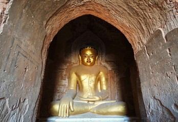 The golden buddha statue in the temple in Bagan, Myanmar