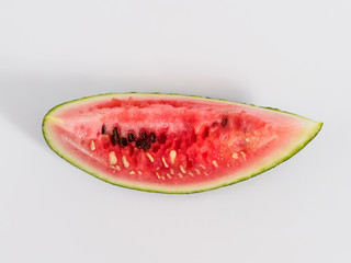 Fototapeta na wymiar Bitten slice of watermelon on white background.