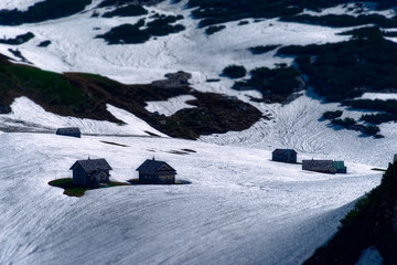 huts in snow covered mountains