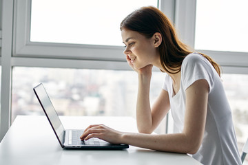woman working on laptop at home