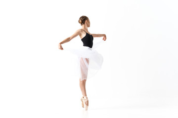 young ballet dancer in action isolated on white