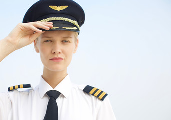 portrait of strong independent business woman. Female young pilot in uniform at work
