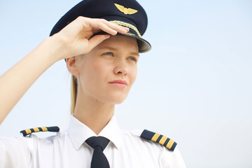 portrait of inspirational female woman any work. Closeup of strong Female pilot in uniform.  - obrazy, fototapety, plakaty