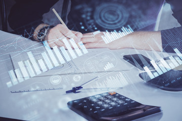 Double exposure of man doing analysis of stock market with forex graph.