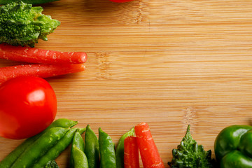 Raw vegetable on wooden board with copy space  