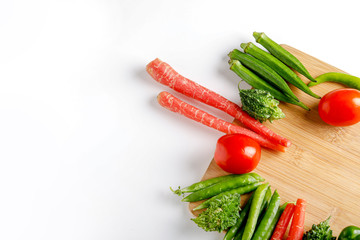 Raw vegetable on wooden board with copy space  